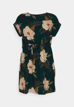 Floral dress featuring a dark green background with large beige and gold flowers, short sleeves, side pockets, and a tied waist detail.