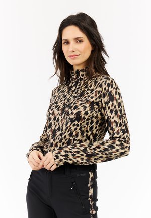 T-shirt à manches longues et col montant dans un motif abstrait multicolore avec des nuances de beige, marron et noir. Tissu léger et lisse.