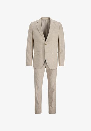 Lichtbeige pak gemaakt van gestructureerde stof, met een jasje met twee knopen en notch-revers en bijpassende platte broek.