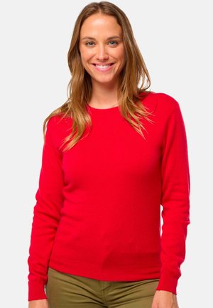 Sweatshirt en tricot rouge à manches longues, encolure ronde et poignets côtelés. Fabriqué dans un matériau doux, présentant un design ajusté.