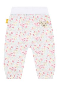 Babyhose aus weichem Stoff mit einem elastischen weißen Bund. Das Pastellmuster zeigt Blumen und Muscheln. Ein Bären-Patch schmückt die Seite.