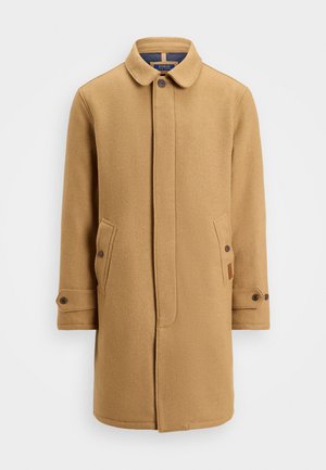 Manteau en laine mélangée beige avec un col, fermeture à boutons, deux poches latérales et poignets ajustables. Présente un tissu texturé et un design minimaliste.