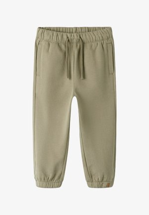 Lys grønne træningsbukser med elastisk talje, snorelukning, sidelommer og elastiske manchetter ved anklerne. Blødt, glat stof.