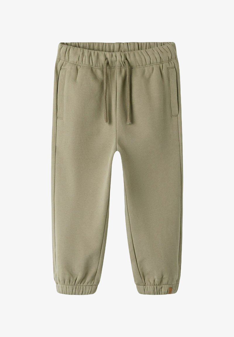 Pantalon de survêtement vert clair avec une taille élastique, cordon de serrage, poches latérales et poignets élastiques aux chevilles. Texture de tissu douce et lisse.