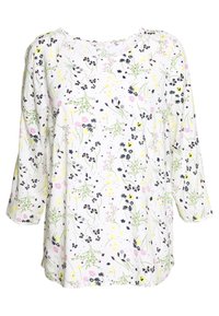 Blusa bianca con maniche a tre quarti, caratterizzata da un motivo floreale in rosa, giallo e nero. Tessuto morbido e leggero con scollatura rotonda.