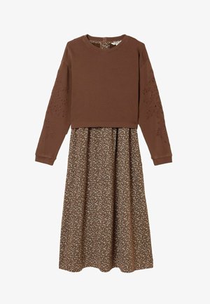 Brown sweater top with long sleeves, featuring embroidered details. Flowy brown floral skirt with a lighter floral pattern below.