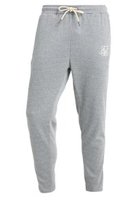 Grå herringbone sweatpants med dragsko i midjan, avsmalnande passform och broderad logotyp på vänster lår. Mjuk tygtextur.
