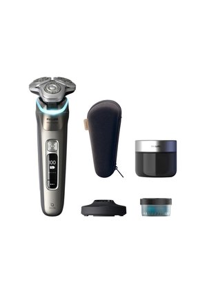 Electric shaver with silver and black material, three rotary heads, LED display, and includes a charging dock, travel case, balm, and cleaning solution.