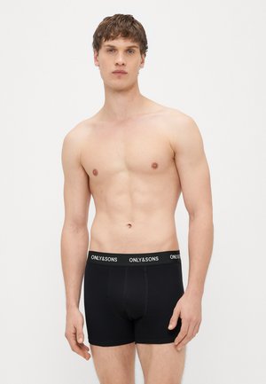 Schwarze Boxershorts mit elastischem Markenbund. Baumwollstoff mit glatter Textur, figurnahes Design und Standardlänge.