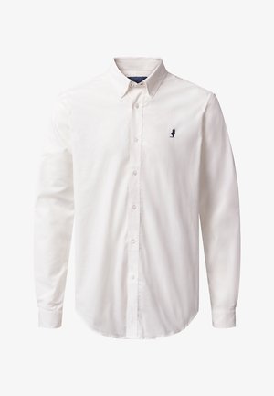 Valge pika varrukaga nööbiga särk, millel on nööbitav krae ja vasakul rinnal väike must tikandiga logo.