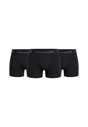 Tres calzoncillos bóxer negros de hombre Tommy Hilfiger con cintura elástica con marca, dispuestos uno al lado del otro sobre un fondo blanco.