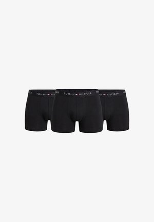 Tre boxer neri da uomo Tommy Hilfiger con fascia elastica brandizzata, disposti uno accanto all'altro su sfondo bianco.