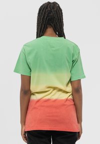 Green to yellow gradient t-shirt with orange lower section. Short sleeves, relaxed fit, soft cotton material, and minimal neckline.