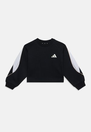 Sweat-shirt court noir à manches longues avec des panneaux en mesh blanc sur les manches et un petit logo rayé blanc en biais sur la poitrine.