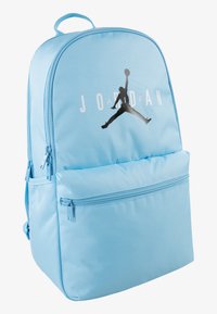 Light blue Jordan backpack with front zip pocket and black Jumpman logo along with white "JORDAN" text on front.
