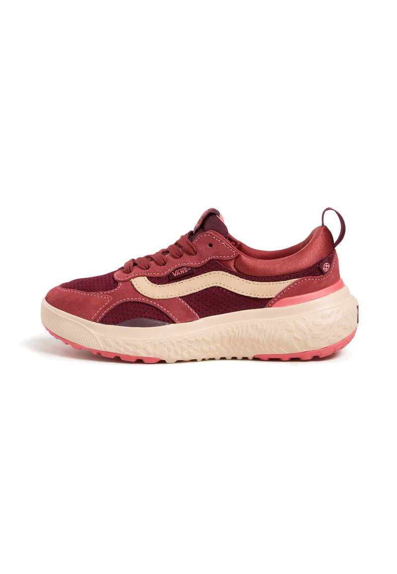 Red and beige athletic shoe featuring a mesh and suede upper, thick textured sole, round toe, and subtle logo detail.