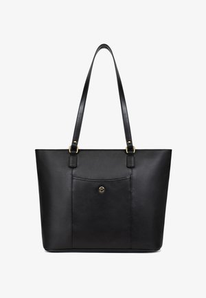 Borsa tote in pelle nera con sottili spalline, tasca frontale e piccolo emblema rotondo dorato al centro della tasca.