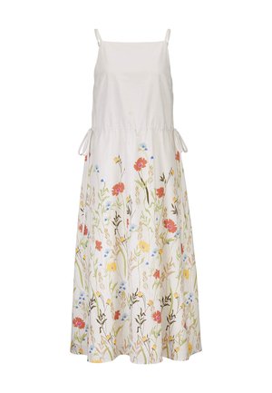Witte mouwloze maxi-jurk met dunne bandjes en zijstrikjes, met een kleurrijke bloemenprint op de rok met rode, gele en blauwe bloemen.