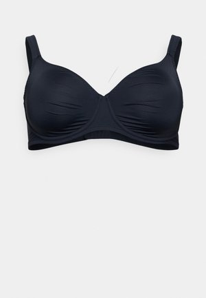 Navy blue soft fabric bra with molded cups, adjustable straps, and seamless edges. Features slight ruching for texture and support.