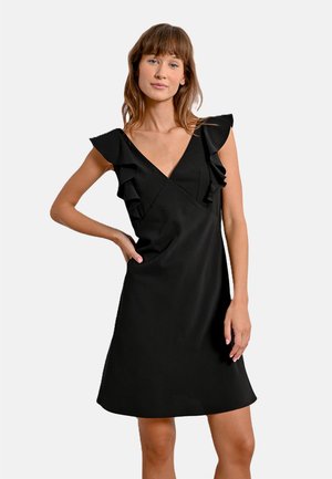 Abito nero con maniche a volant, scollatura a V e forma ad A. Realizzato in un tessuto morbido con un design pulito e minimalista.