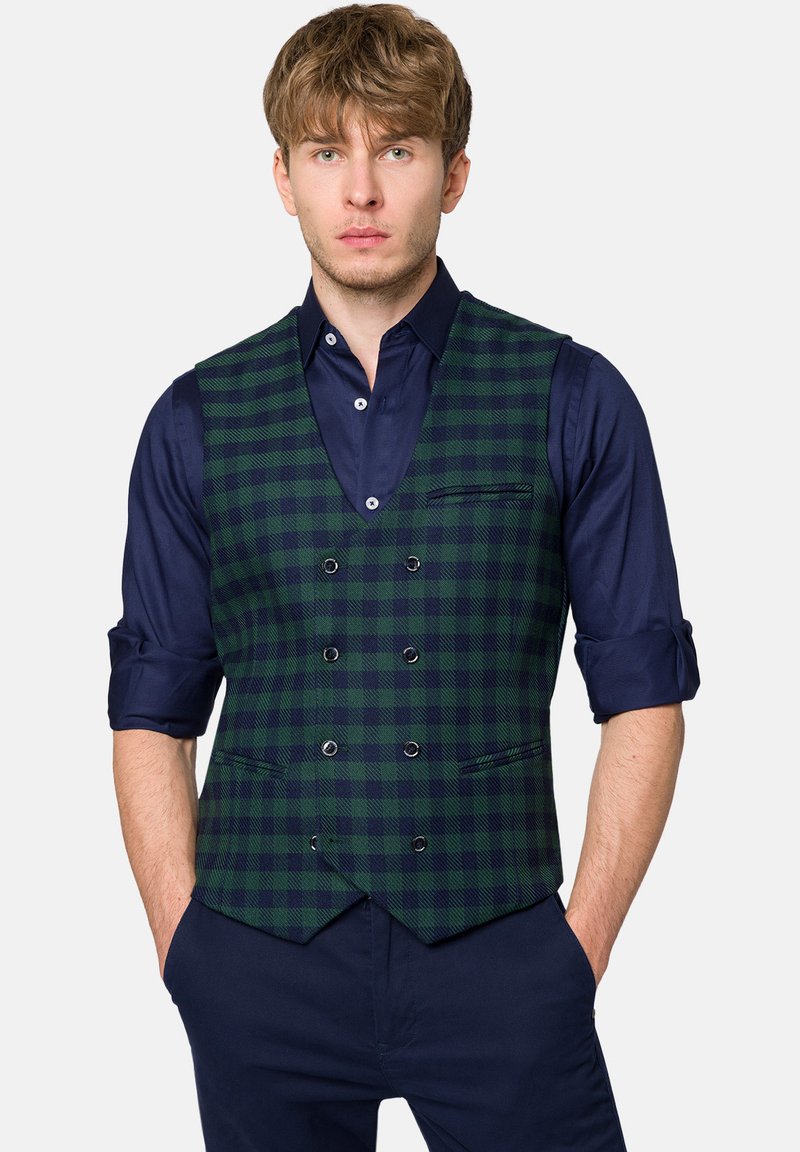 Zielono-granatowa kamizelka w kratę o dopasowanym kroju, z podwójnym zapięciem z przodu, dwoma kieszeniami oraz granatową koszulą pod spodem.