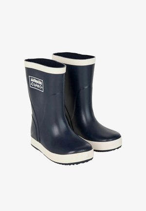 Marineblaue Gummiregenstiefel mit weißem Rand. Mit einer abgerundeten Spitze, flacher Sohle und einem markierten Patch an der Vorderseite. Strukturierte Innenauskleidung.