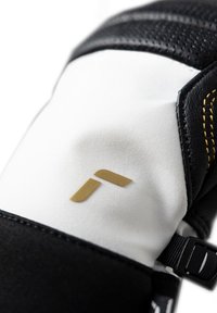 Sort-hvide handsker med et guld-logo, strukturerede sorte læderdetaljer og kontrasterende gul syning, med en justerbar rem.