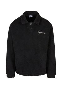 Pullover in pile nero con superficie testurizzata, bottoni a vista e colletto. Presenta un logo bianco sulla parte sinistra del petto.