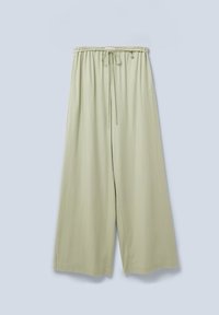 Pantaloni a gamba larga verde chiaro con cintura elastica, cordoncino e branding sottile sui lati. Texture liscia con una vestibilità comoda.