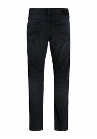 Jeans de mezclilla oscuros de corte ajustado con una textura suave, que cuentan con un diseño clásico de cinco bolsillos y sutilezas en las costuras de los bolsillos traseros.