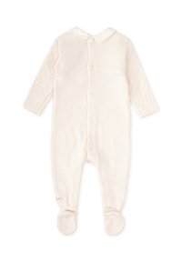 Un body de bebé color crema con cuello, mangas con estampado, botones en la parte delantera y diseño con pies. Tejido de punto suave.