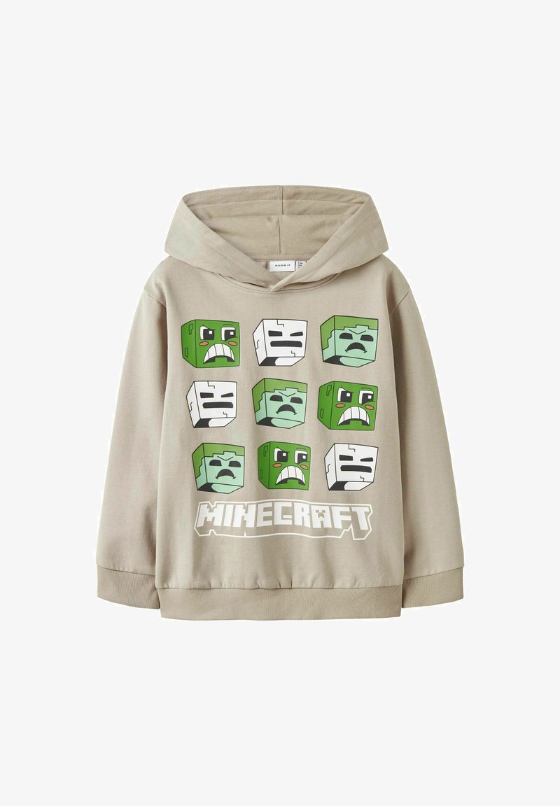 Sudadera con capucha beige que presenta estampados de personajes de Minecraft en verde y blanco. El diseño gráfico destacado incluye expresiones faciales y el logotipo.