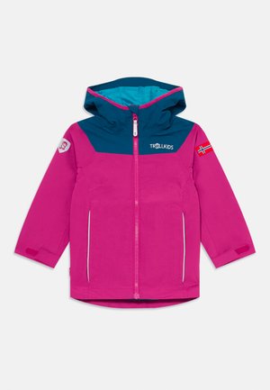 Child’s pink and blue jacket with hood, front zipper, side pockets, Trollkids logo on chest, and Norwegian flag patch on sleeve.