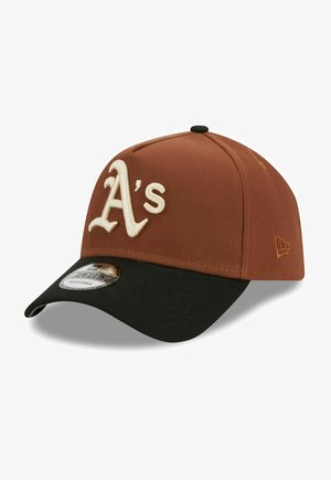 Brown and black baseball cap with a curved brim, featuring an embroidered "A's" logo in cream. Made of textured fabric with an adjustable back.