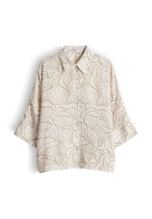 Blouse ample à manches courtes avec boutons et large col, présentant un motif abstrait de feuilles beiges sur fond crème clair.