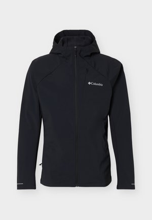 Svart Columbia softshell-jakke med hette, hel frontglidelås, glidelåslomme på brystet og lange ermer med reflekterende mansjetter.