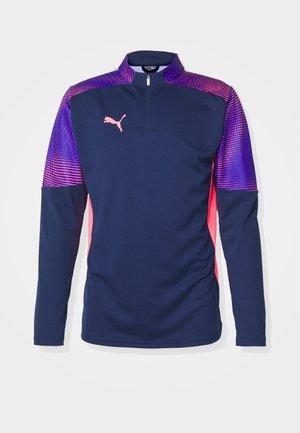 Marinefarbener Sportpullover mit Viertelreißverschluss; lila und pink gemusterte Akzentüberzüge an den Ärmeln; strukturierter Stoff; mit einem Puma-Logo auf der Brust.