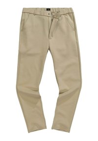 Béžové kalhoty vyrobené z měkké látky s tapered designem. Obsahují přední kapsy, zapínání na knoflík a viditelné švy.