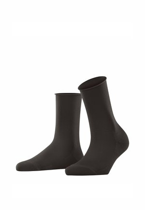 Chaussettes noires de type crew fabriquées à partir d'un matériau lisse et élastique. Elles présentent un orteil renforcé et une bordure côtelée pour un maintien sûr.
