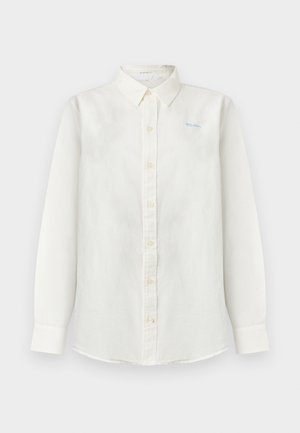 Balta garām piedurknēm krekls ar pogām, apkakli un nelielu gaiši zilu izšuvumu kreisajā krūtīs ar uzrakstu "Māte".