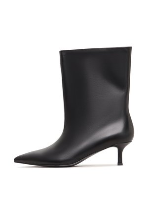 Black mid-calf leather boot with pointed toe and slender kitten heel, sleek smooth finish, side profile view on white background.
