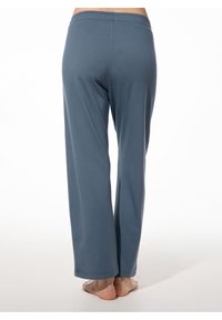 Helleblaue, lässig geschnittene Hosen aus weichem Stoff. Sie verfügen über einen elastischen Bund und weite Beine mit glatter Oberfläche und ohne sichtbare Muster.