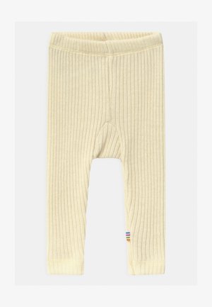 Leggings jaunes à côtes avec une finition texturée et une taille élastique. Présente un accent rayé multicolore au bas.