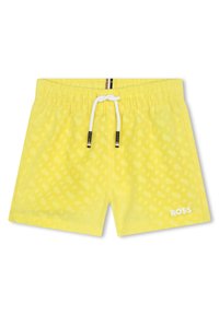 Costume da bagno giallo con un sottile motivo geometrico, vita elasticizzata con cordino e logo bianco sul lato inferiore.