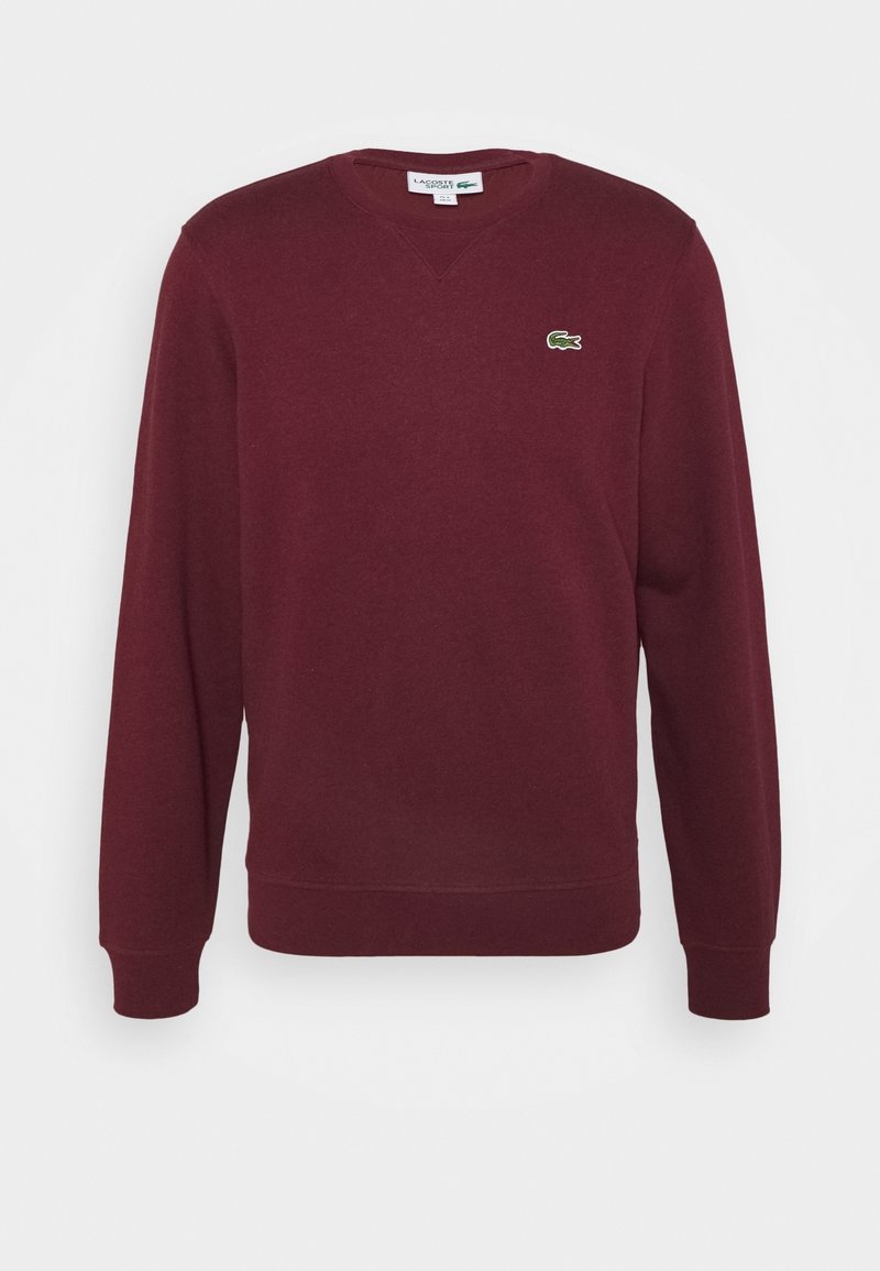 Sweat-shirt bordeaux à manches longues avec col rond et petit logo crocodile vert sur la poitrine gauche.