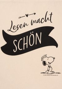 Borsa in cotone con sfondo crema, caratterizzata da testo nero "Lesen macht Schön" e un personaggio dei cartoni animati con espressione sorridente.