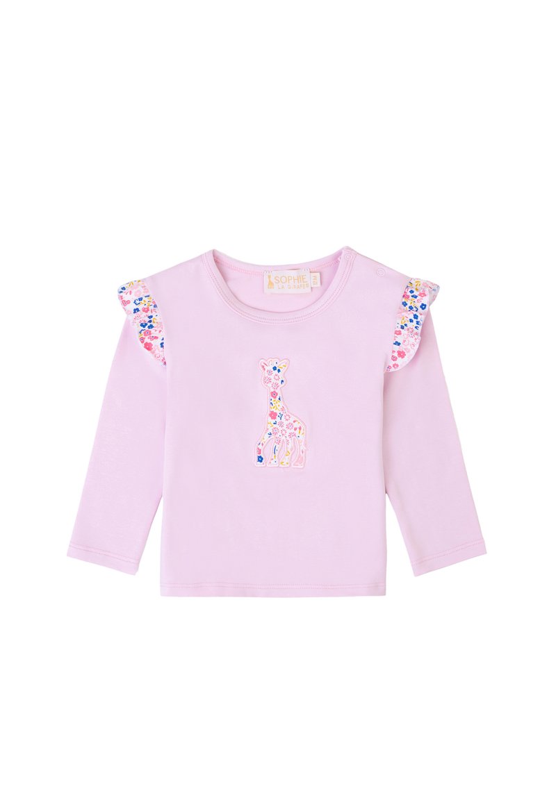 Camicia a maniche lunghe di un rosa chiaro con volant a fantasia floreale e un'applicazione di un giraffe colorato al centro della parte anteriore. Il tessuto sembra morbido e liscio.