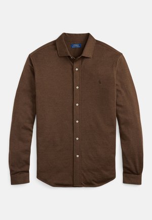 Hosszú ujjú barna, gombos ing finom textúrával, gallérral és a Polo Ralph Lauren logóval a bal oldali mellrészen.