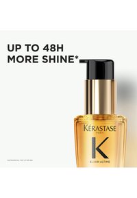 Flacon d'huile capillaire Kérastase Elixir Ultime avec pompe noire et texte indiquant jusqu'à 48 heures de brillance supplémentaire.