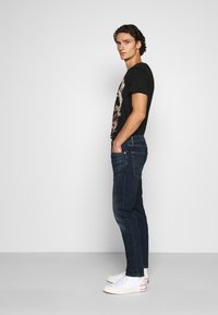 Levi's® 502™ TAPER HI-BALL - Calças de ganga de perna direita - med indigo